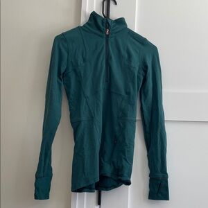 Lululemon size 4 half zip. Worn. No tags. Great condition